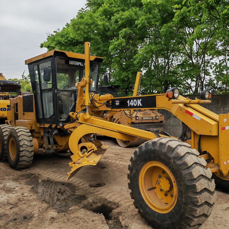 ব্যবহৃত খননকারী জমির সমতলকরণকারী Caterpillar CAT140K রোডার মেশিন ভাল অবস্থায় ব্যবহৃত জাপান ট্র্যাক্টর ইঞ্জিন